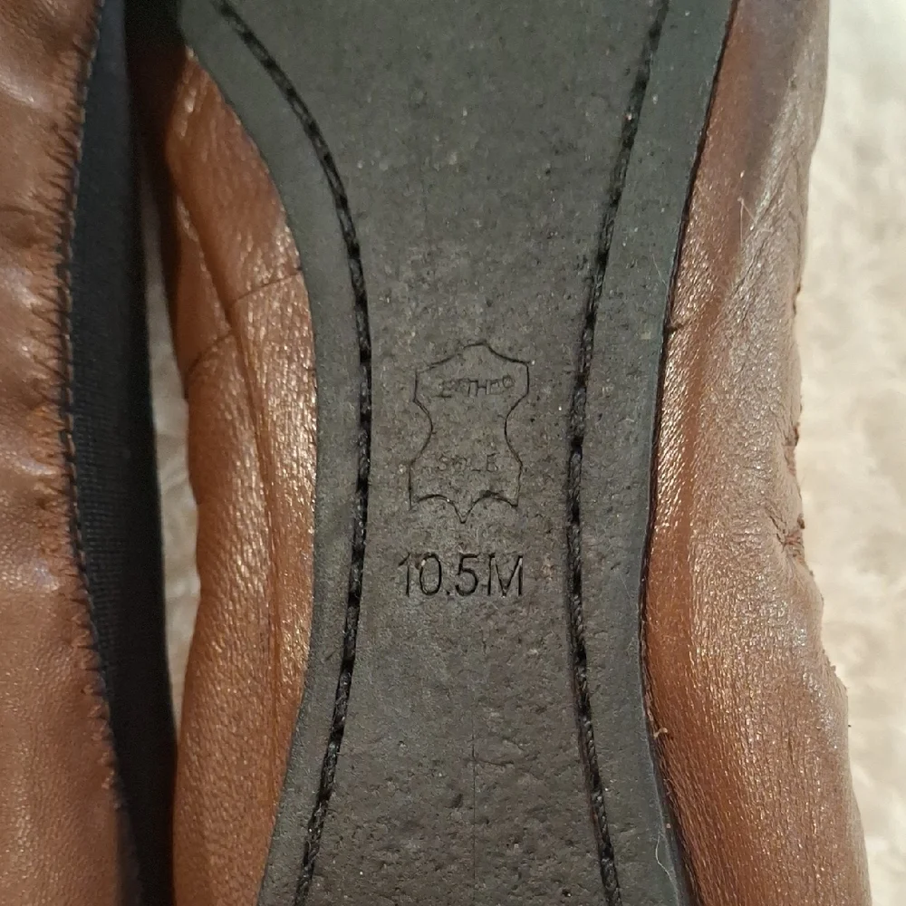 Tory Burch Brown and Black Flats with Gold Medallion - Picture 4 of 9